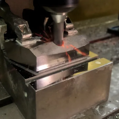 Machined tungsten alloy parts and assemblies